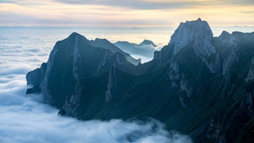 Hoher Kasten and mountains at sunrise, high fog in the valley, view from Säntis, Appenzell