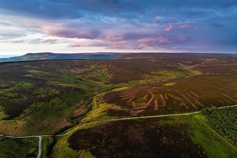 Sunset over Cod Beck Reservoir from a drone, North York Moors National Park, North Yorkshire,