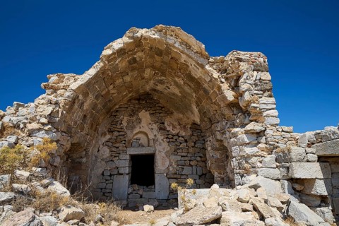 Dilapidated stone buildings under clear blue sky, remains of an old construction, Johanniter