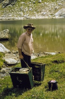 The Trail Creek, Farmer brings laundry to the river for washing, Wyoming Dude Ranch, USA,