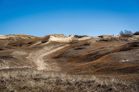 The Gray Dunes, or the Dead Dunes is sandy hills with a bit of green specks at the Lithuanian side