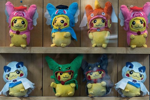 Pokémon figures with various masks in a shop window, Enschede, the Netherlands