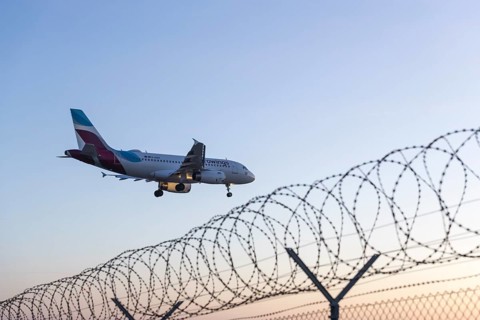 Aeroplane approaching, security fence, barrier fence, Stuttgart-Echterdingen Airport,