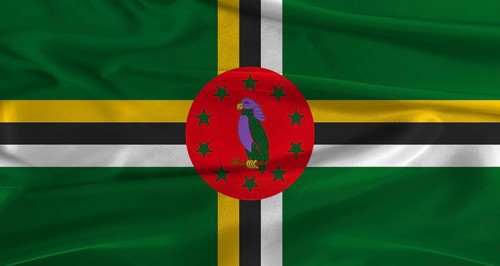 Flag of Dominica with fabric textured background. Close up of National flag of Dominica with