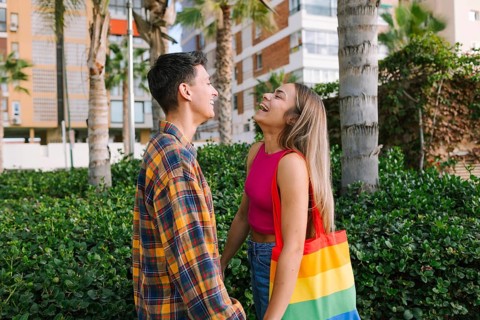 A happy lesbian couple shares a joyful moment outdoors, reflecting love and togetherness. With a
