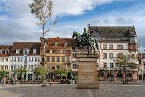 Equestrian statue of Prince Regent Luitpold and maypole on the town hall square in Landau in der