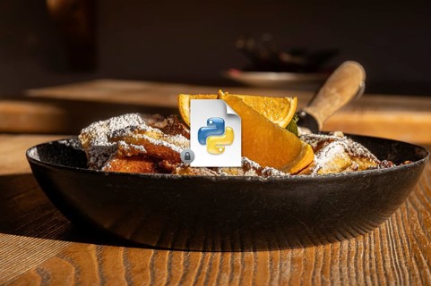 Serving of Austrian Kaiserschmarrn, a shredded pancake, dusted with powdered sugar and accompanied