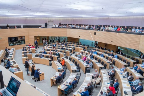 Full parliament in active discussion with round seating, state parliament of Baden-Württemberg,