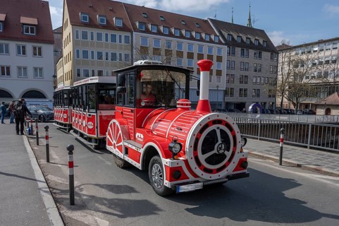 Train with tourists travelling through the city centre, Nuremberg, Middle Franconia, Bavaria,