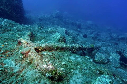 Underwater photo of historic anchors over great depths of old stick anchors lying at great depth,