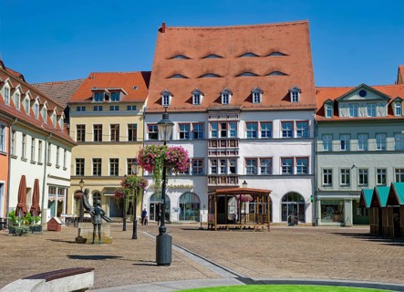 Naumburg wood market with historic heritage-protected buildings and the Nietzsche monument by