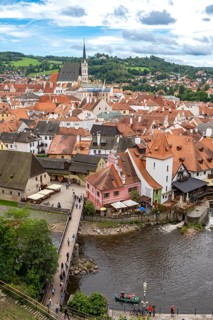 Aerial view of the historic centre of Ceský Krumlov town with bridge, Vltava river, and church