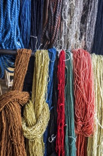 Coloured strands of dyed wool for weaving clothes