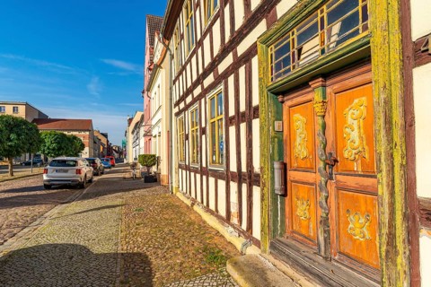 Half-timbered house with carved and painted wooden door at the historic pottery market, old town