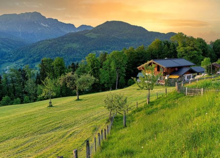 Landscape with meadows, farmhouse and mountains, Berchtesgaden, Bavaria, Germany