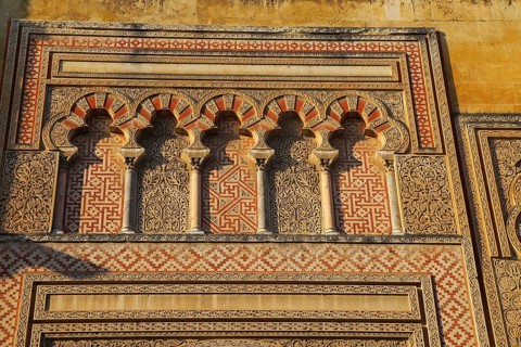 Moorish doorway arches elaborately inscribed stonework of the mezquita Great Mosque, Cordoba, Spain