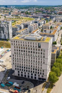 Urban modern high-rise building with green roof and views of an urban landscape, Boarding House of