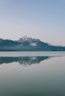 Frosty morning atmosphere during sunrise at Lake Hopfensee in the Allgäu in Bavaria, Germany