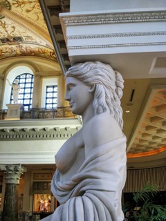 Classic female marble statue, caryatid, roman style, decorative element, architectural detail at