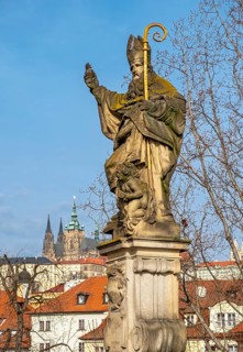 Statue of Augustine of Hippo with the Prague Castle, Charles Bridge, Praha, Czech Republic