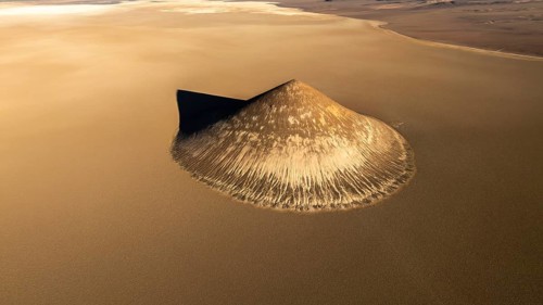 Top view, the Cono de Arita is captured in stunning detail, set amidst the sprawling sands of