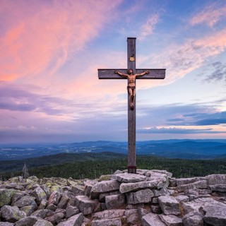 On the summit of the Lusen, summit cross at sunset, Bavarian Forest National Park, Bavaria, Germany