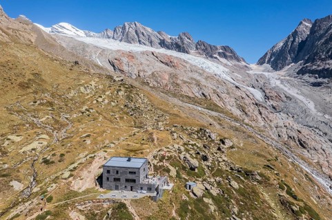 Aerial view of mountain hut Peter Tscherrig Anenhütte, alpine rocky landscape, Loetschental valley,