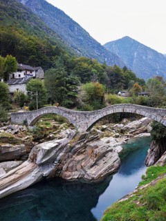 Historic Ponte dei Salti with double arches, Roman bridge, over the Verzasca river, Verzasca