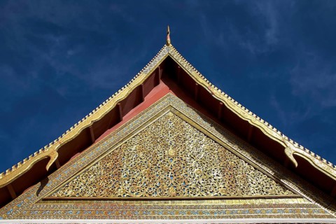 Close-up of a richly decorated temple roof with golden elements, Loro Parque, Puerto de la Cruz,