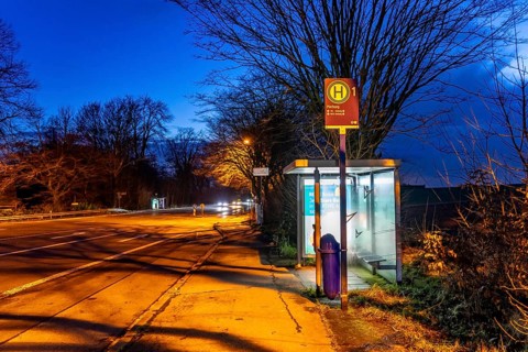 Bus stop Pierburg, in the evening, illuminated, Meisenburger Straße, Essen-Schuir, line 142, in the