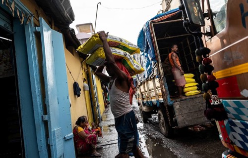 GUWAHATI, INDIA - MAY 1: Labourers carries goods in a wholesale market, in Guwahati, India, on May