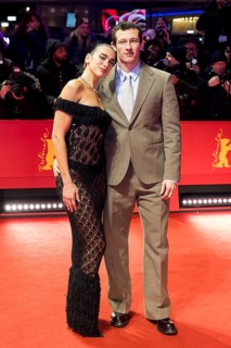 Dua Lipa and Callum Turner on the Red Carpet in front of the premiere of Rosebush Pruning at the