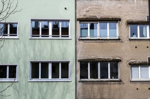 Windows, gray house facades, a house is renovated, renovation, modernization, contrast, difference,