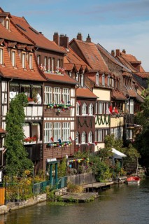 20 August 2026, decorated historic half-timbered houses along the Regnitz river during the