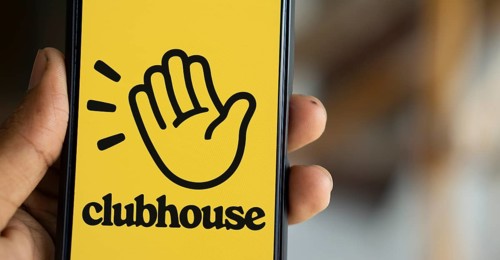 Clubhouse logo is displayed on smartphone. Clubhouse is a social audio app for iOS and Android.