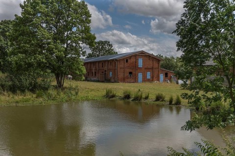 Former pigsty from 1920 on an estate, in front of the extinguishing pond, Othenstorf,