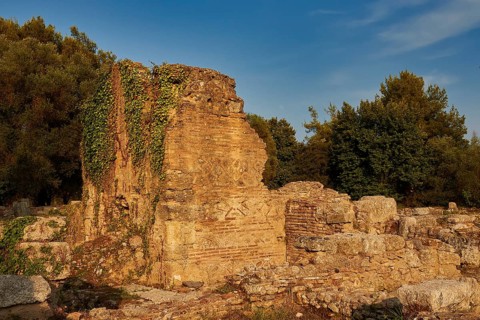 Southern Baths, Ancient Walls Covered with Ivy Against a Blue Sky, Archaeological Site, Ancient