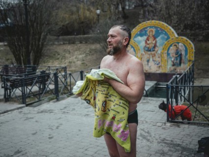 Man after a morning swim in a public bathing facility in Severno Saltivka. The neighbourhood was