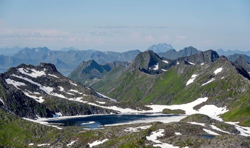 Mountain peak and lake, view at the summit of Rundfjellet, Svolvaer, Nordland, Norway