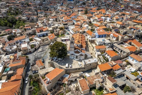 Town view Pano Lefkara with the church Timiou Stavrou seen from the air, Cyprus