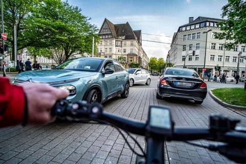 Cycling in the city, city centre road, cycle lane, bikes have right of way, 30 km/h zone, traffic