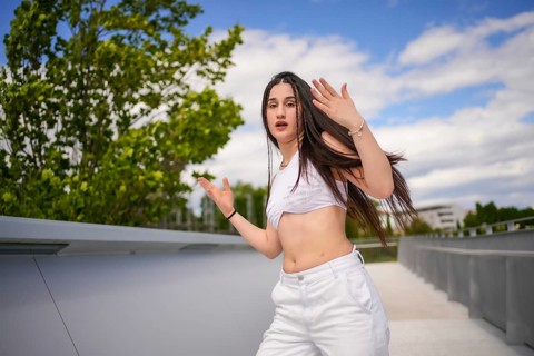 Vital beauty caucasian young woman dancing freestyle in an urban park