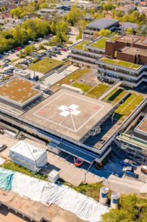 Detailed view of a hospital with a distinctive helicopter landing pad on the roof, Nagold Hospital