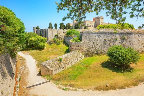 View of Rhodes city medieval defensive walls and Palace of the Grand Master of the Knights of