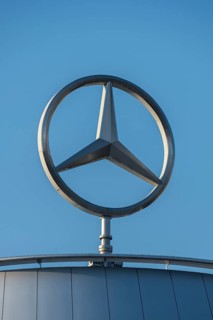 Mercedes symbol on a building under a blue sky, Mercedes star, Stuttgart-Untertürkheim,