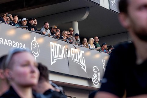 Adenau, Germany, 7 June 2024: Fans on the grandstand at Rock am Ring. The festival takes place at