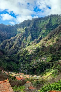 Curral das Freiras surrounded by mountains, parish of the district of Câmara de Lobos, tourist