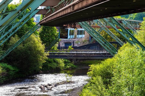 The Wuppertal suspension railway runs through a historic district and industrial area near the