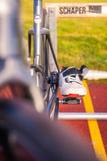 Close-up of a racing bike with a shoe on the pedal on a racetrack, triathlon bike, Calw, Germany