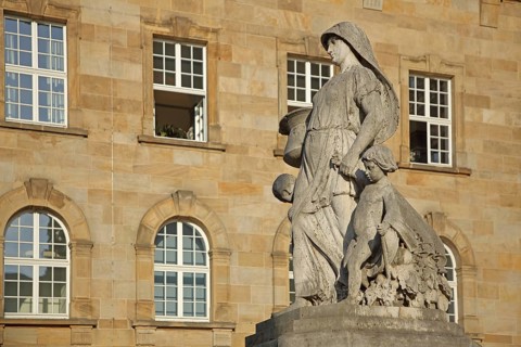 Henschelbrunnen, Henschel, fountain, female figure with children and carrying a pot, stone